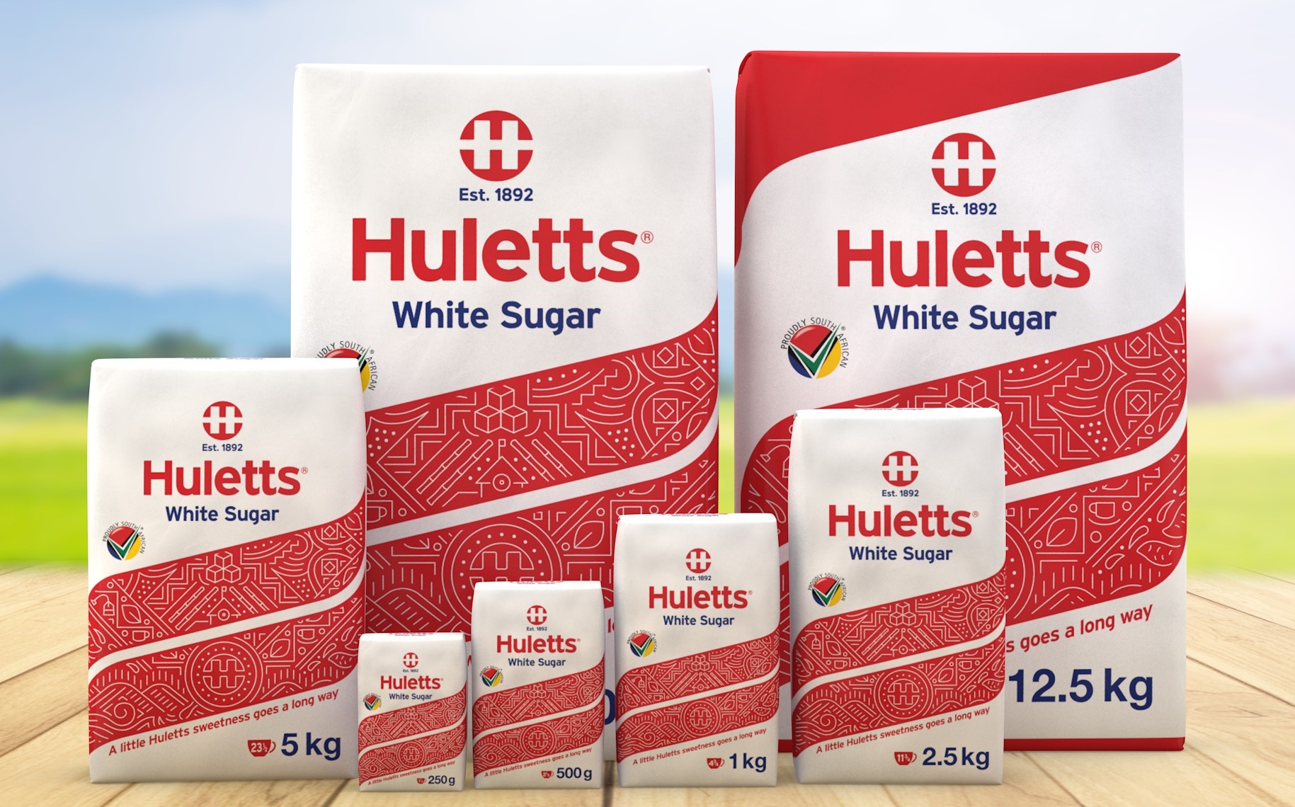 Huletts white sugar packaging design by berge farrell design. Group photo with 12kg packs all the way to 100g packs.